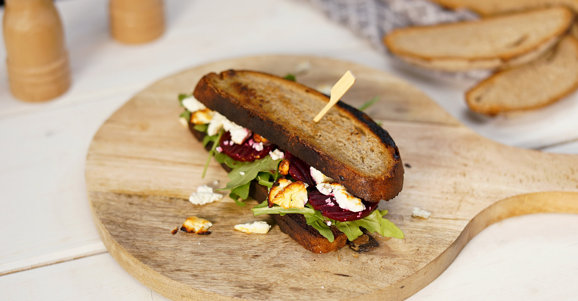 Beetroot sandwich with baked feta and rocket salad